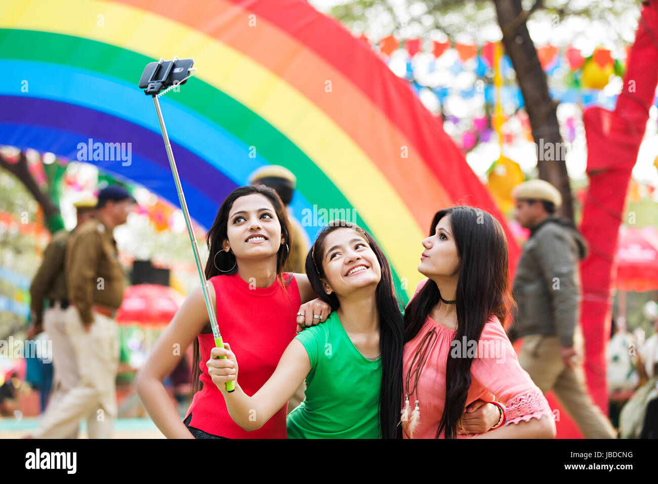 3 Teenager Girls Friends Talking Selfie-Stick Phone Enjoying Mela Stock  Photo - Alamy