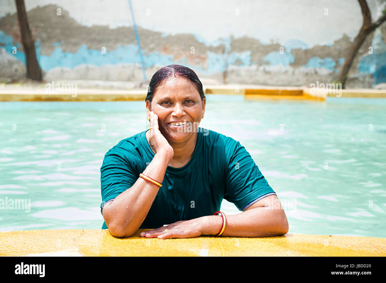 1 Indian Senior Woman Bathing Swimming Pool Waterpark Ledge Stock Photo