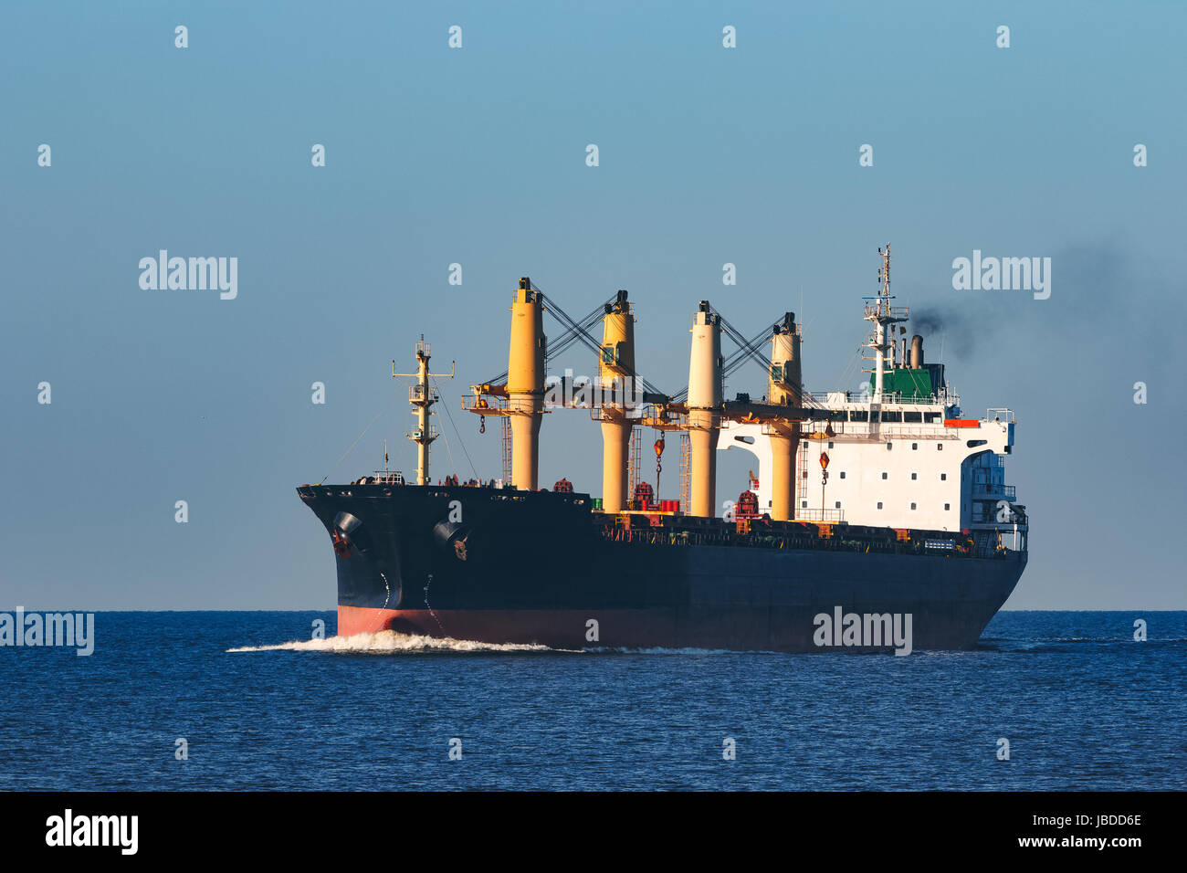 Black cargo ship sailing from the Baltic sea Stock Photo - Alamy