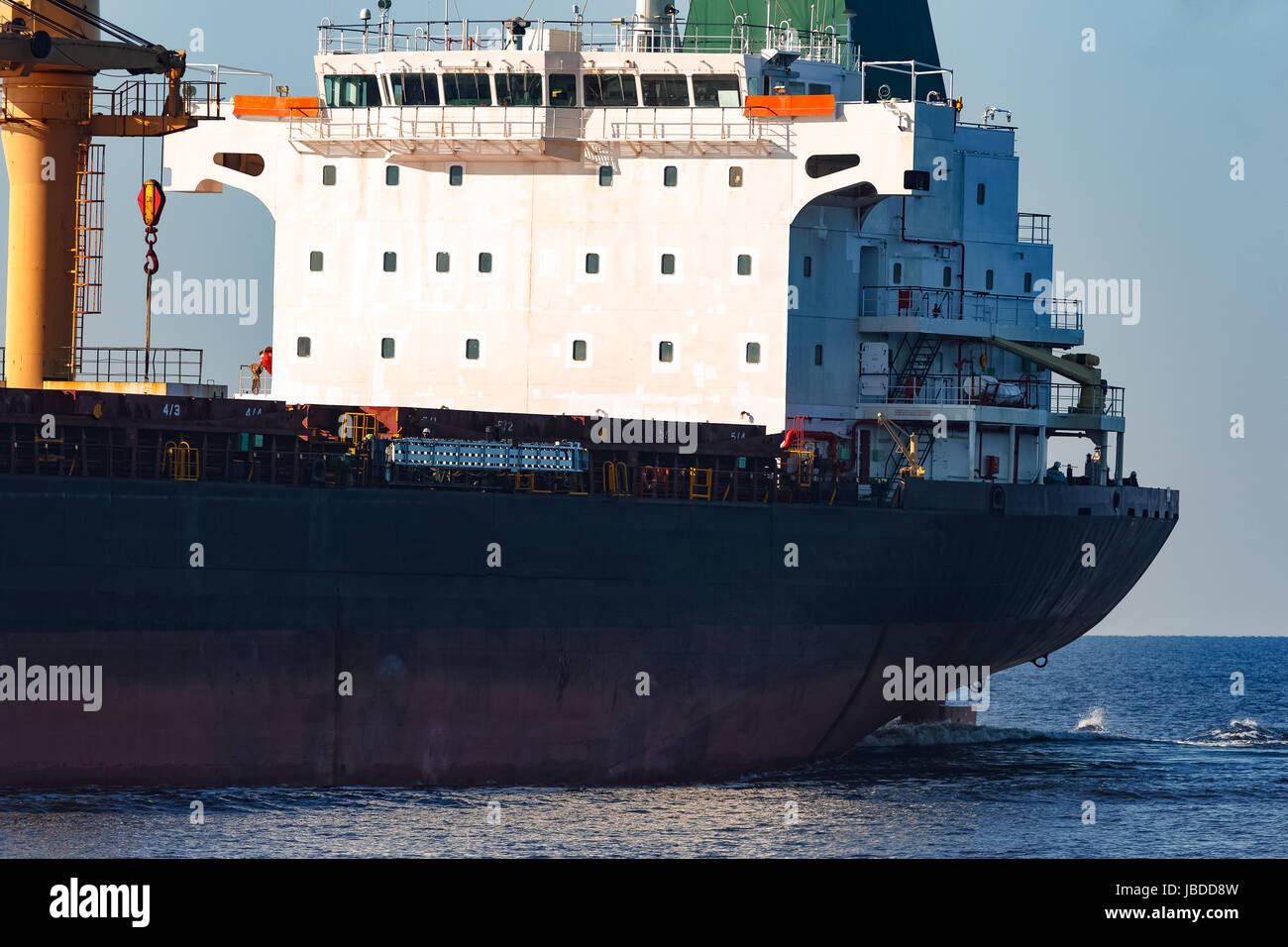 Black cargo ship sailing from the Baltic sea Stock Photo - Alamy