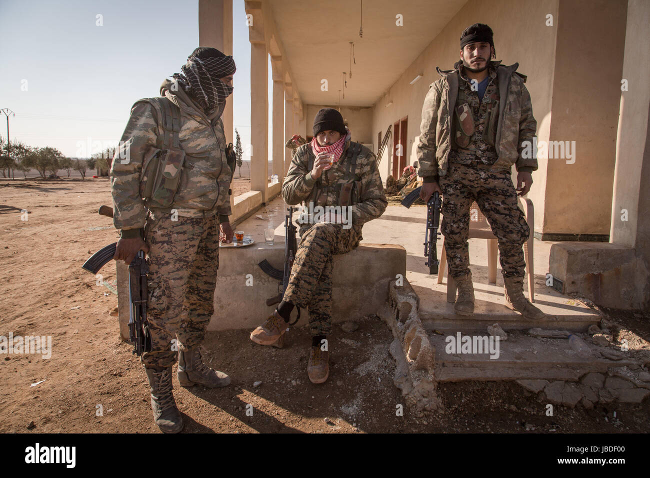 Soldier uniform rifle village desert hi-res stock photography and ...