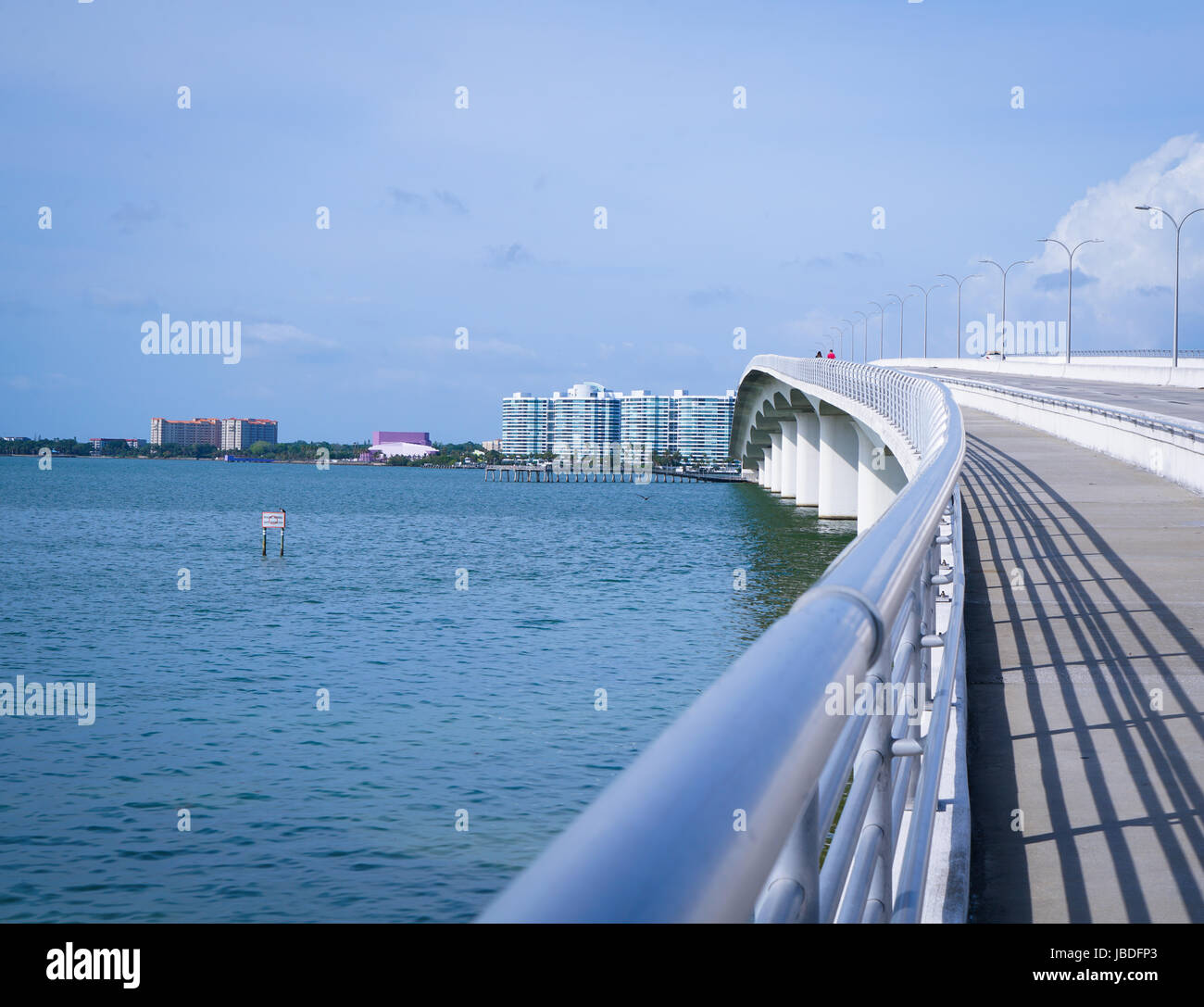 I'm sure the walkway on the bridge has seen its share of walkers, joggers, and bikers cross its path Stock Photo