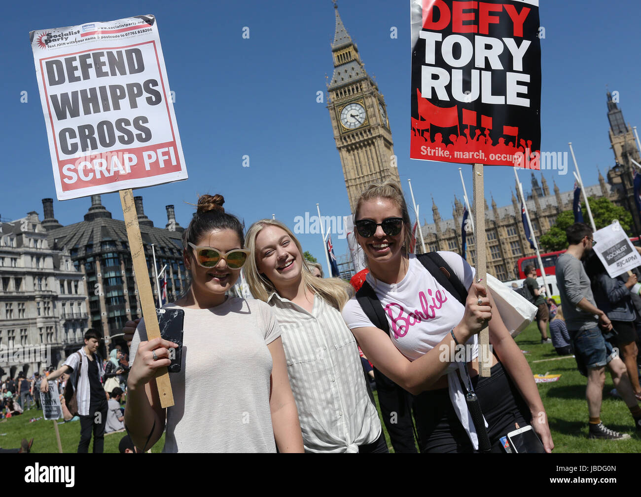 Protesters have gather outside in Westminster, central London to voice their anger at Theresa May's government and her alliance with the Democratic Unionist Party. Stock Photo