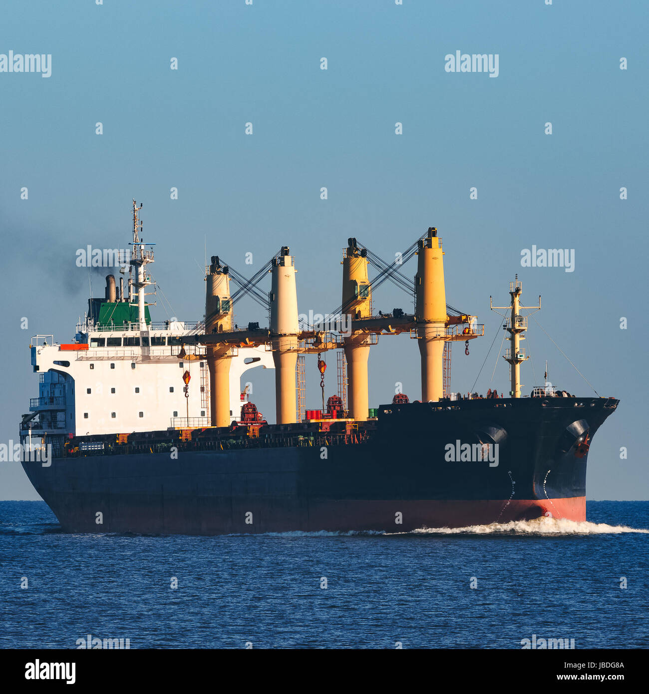 Black cargo ship sailing from the Baltic sea Stock Photo - Alamy