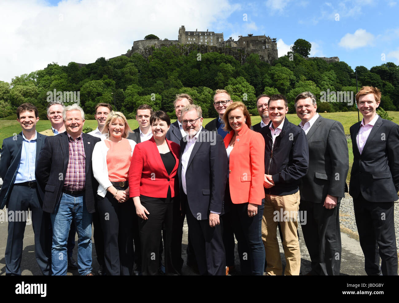Scottish Conservative leader Ruth Davidson (red jacket) at a photo call with the party's newly-elected members of parliament in front of Stirling Castle. Left to right: Andrew Bowie MP, Colin Clark MP, Bill Grant MP, Luke Graham MP, Kirstene Hair MP, Douglas Ross MP, Ruth Davidson, Alister Jack MP, David Mundell MP, John Lamont MP, Rachael Hamilton MSP, David Duguid MP, Ross Thomson MP, Stephen Kerr MP, Paul Masterton MP. Stock Photo
