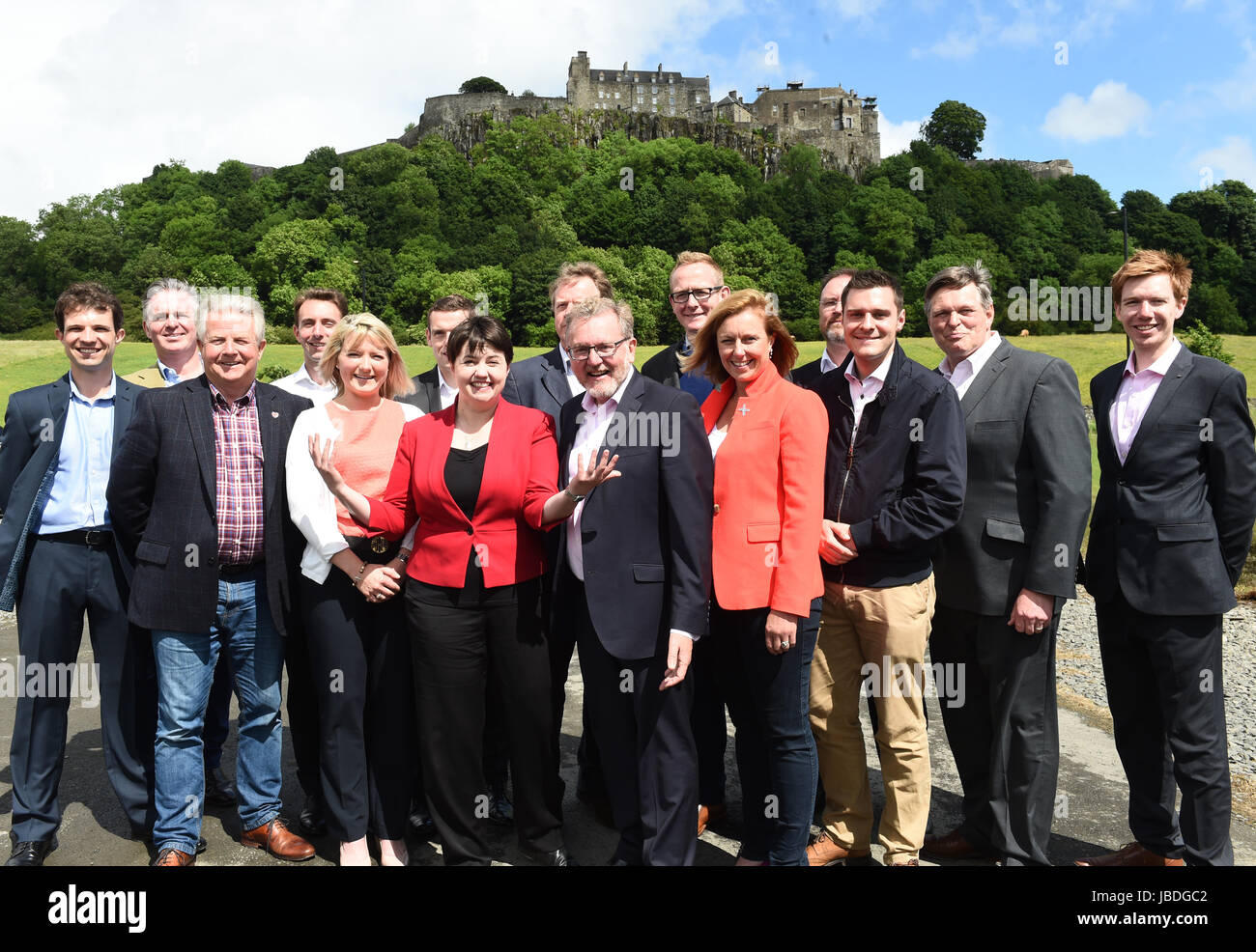 Scottish Conservative leader Ruth Davidson (red jacket) at a photo call with the party's newly-elected members of parliament in front of Stirling Castle. Left to right: Andrew Bowie MP, Colin Clark MP, Bill Grant MP, Luke Graham MP, Kirstene Hair MP, Douglas Ross MP, Ruth Davidson, Alister Jack MP, David Mundell MP, John Lamont MP, Rachael Hamilton MSP, David Duguid MP, Ross Thomson MP, Stephen Kerr MP, Paul Masterton MP. Stock Photo