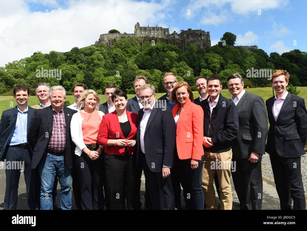 RETRANSMITTED ADDING LEFT TO RIGHT Scottish Conservative leader Ruth Davidson (red jacket) at a photo call with the party's newly-elected members of parliament in front of Stirling Castle. Left to right: Andrew Bowie MP, Colin Clark MP, Bill Grant MP, Luke Graham MP, Kirstene Hair MP, Douglas Ross MP, Ruth Davidson, Alister Jack MP, David Mundell MP, John Lamont MP, Rachael Hamilton MSP, David Duguid MP, Ross Thomson MP, Stephen Kerr MP, Paul Masterton MP. Stock Photo