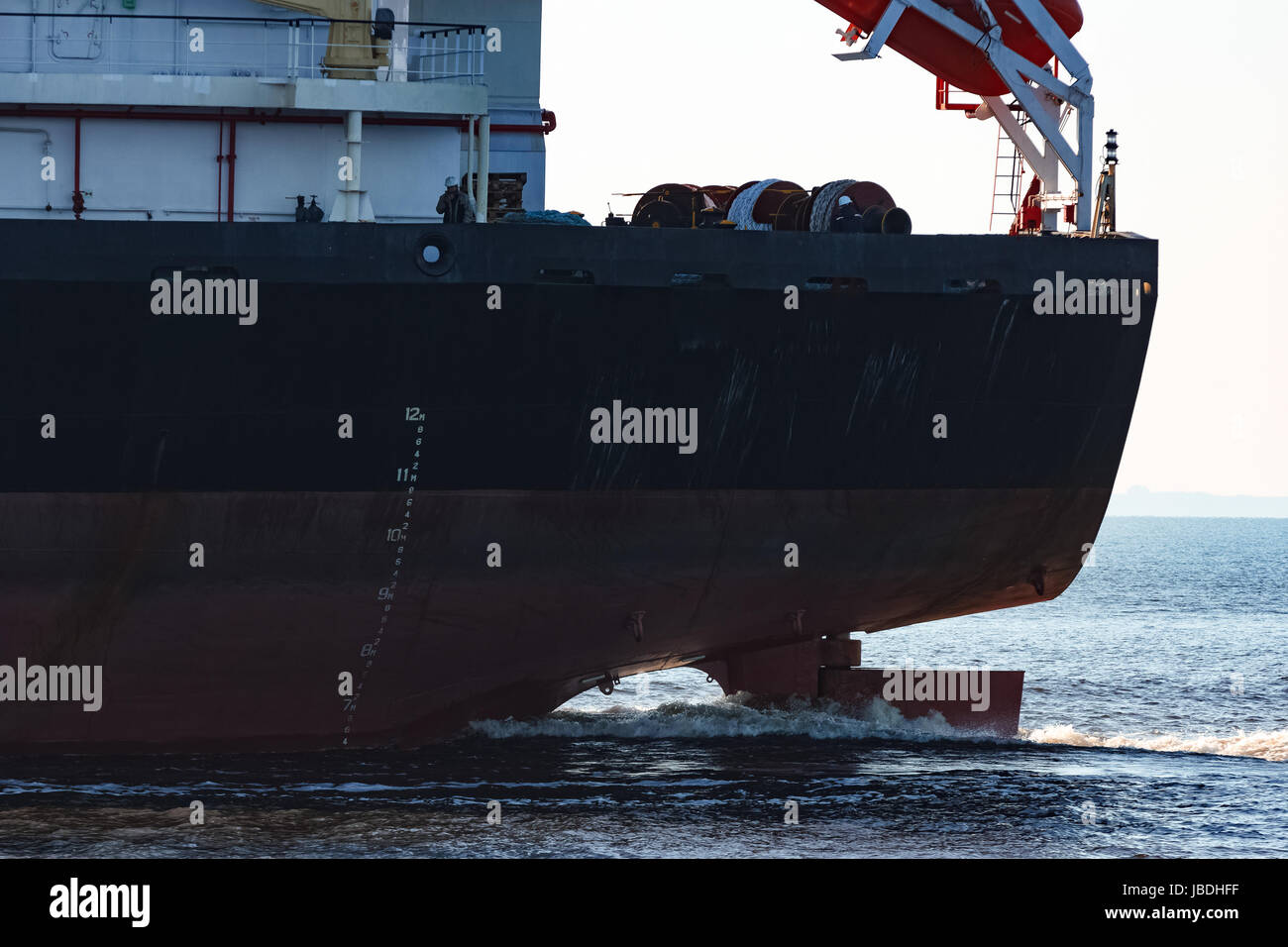 Black cargo ship sailing from the Baltic sea Stock Photo - Alamy