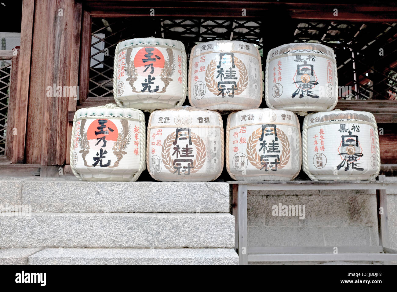 Empty Sake barrels ornament the front of a Shinto shrine in Japan, a cultural tradition believed to connect the Gods with the people Stock Photo
