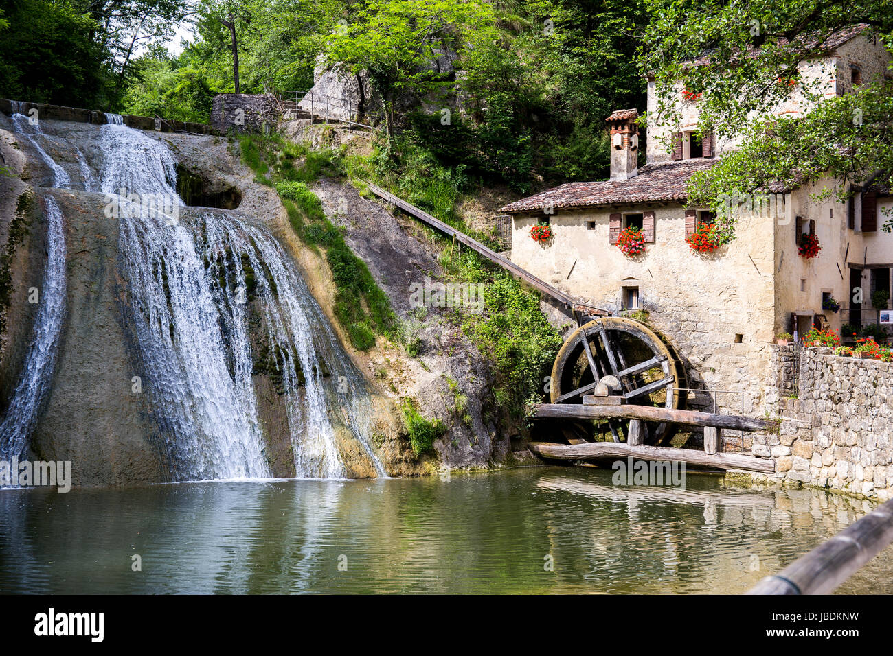 Waterfall with cottage with a water mill - landscape Stock Photo