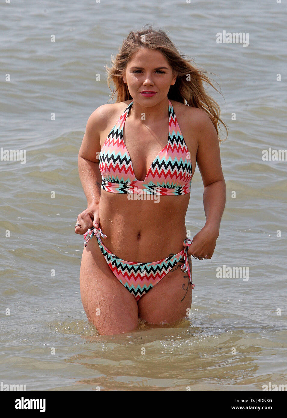 Siobhan Graves, 25, from Leigh on Sea in Essex enjoys the spring sunshine  with a dip in the sea at Chalkwell Beach,Essex earlier today. Featuring: Siobhan  Graves Where: Chalkwell, United Kingdom When: