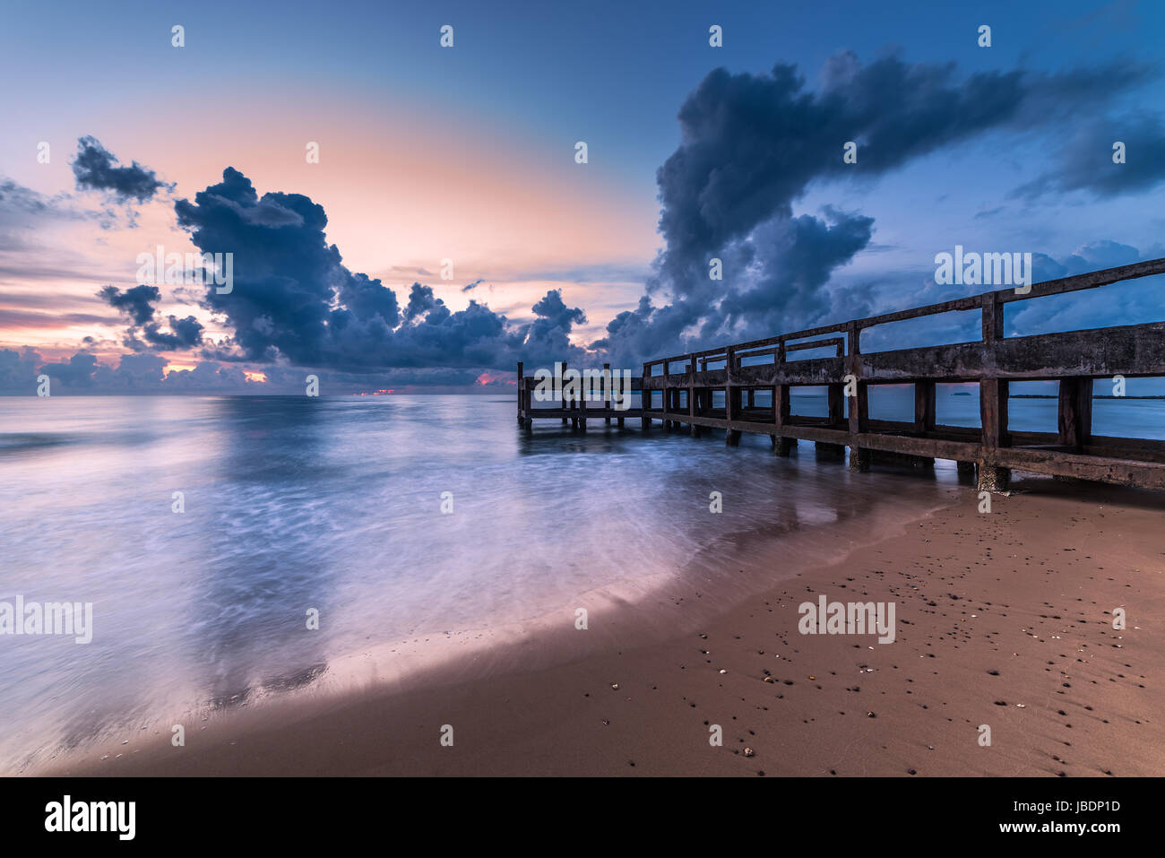 Concrete jetty along side to the sea Stock Photo - Alamy