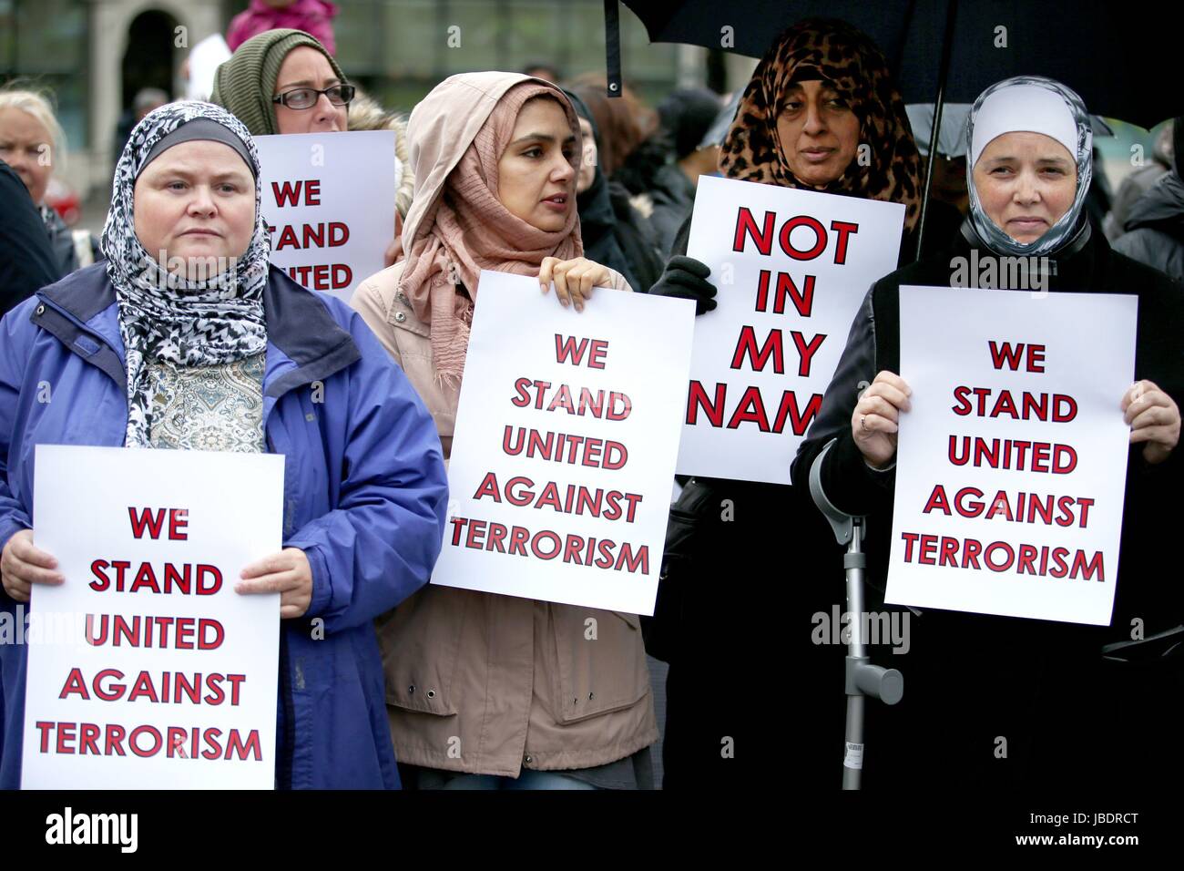 People attending the Muslims Stand Against Terrorism event in George Square, Glasgow. Stock Photo