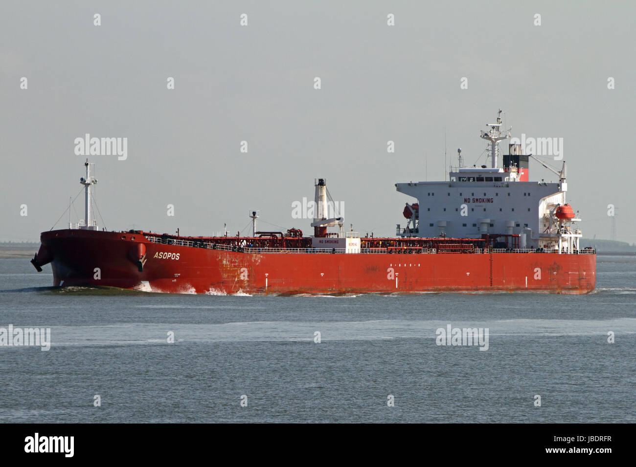 The tanker Asopos leaves the port of Antwerp and passes Terneuzen. Stock Photo