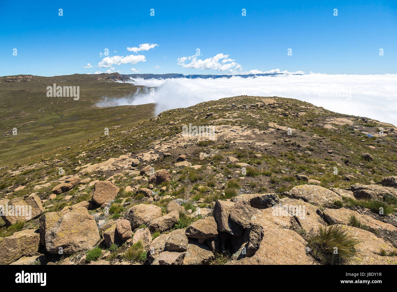 Clouds reaching the plateau of Drakensberge at Sentinel Hike Stock Photo