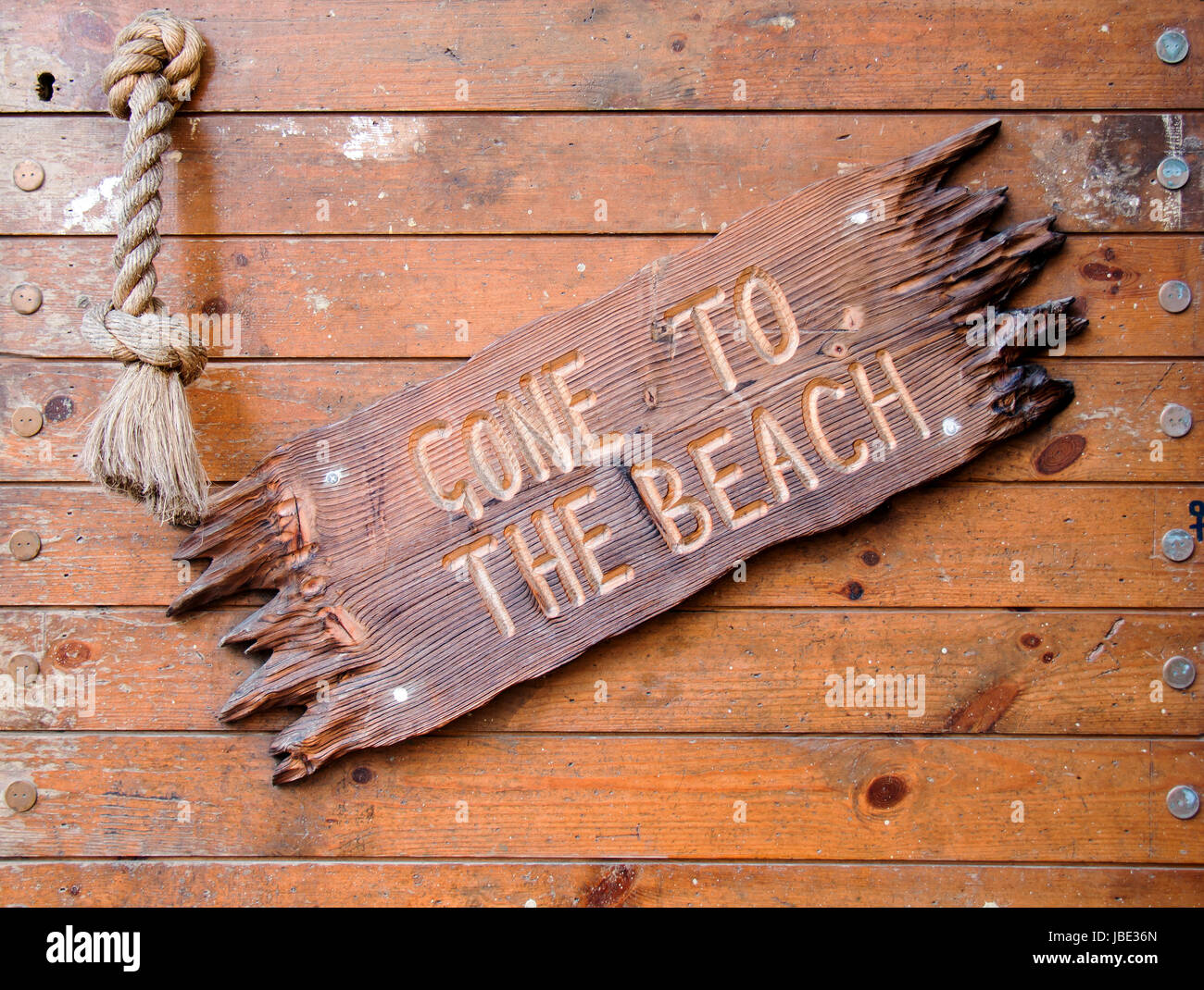 Carved wooden sign Gone to the Beach. Stock Photo