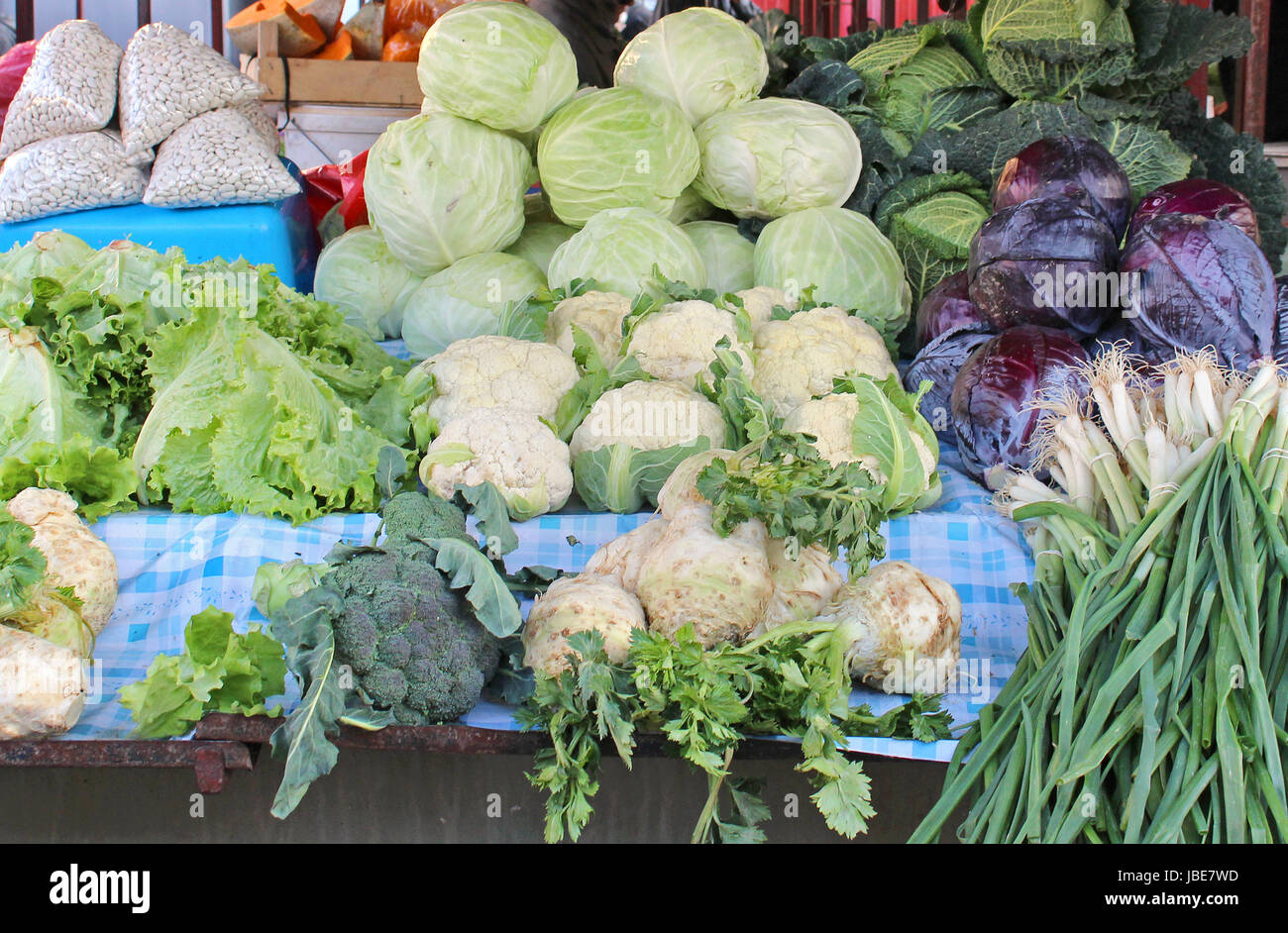 Green vegetables pile sold on market stall Stock Photo - Alamy