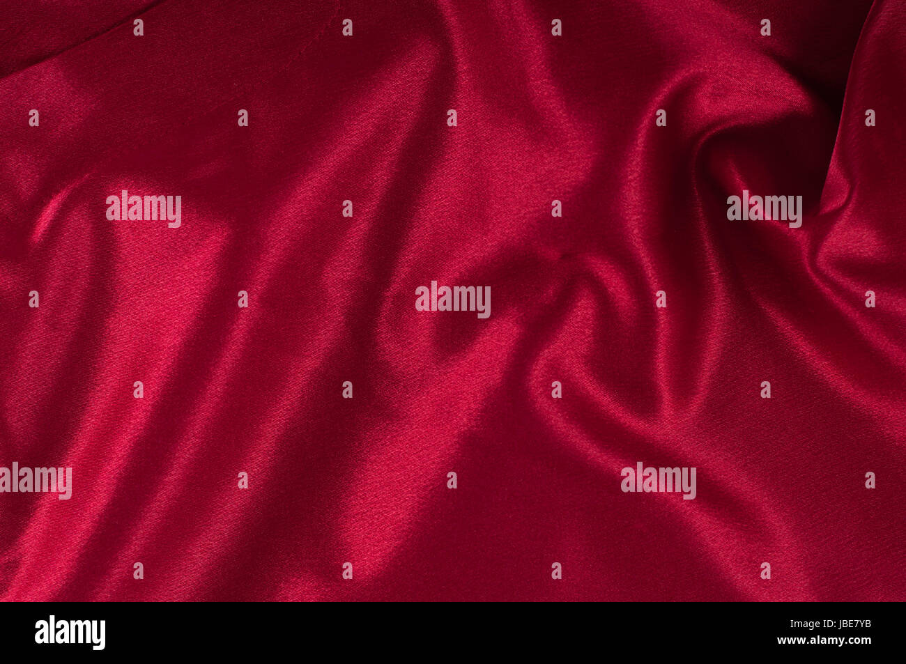Red silky textile background Stock Photo