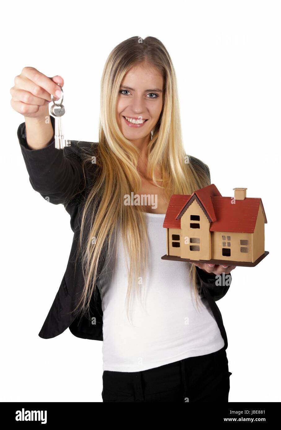 Pretty smiling estate agent woman with keys and model house Stock Photo ...