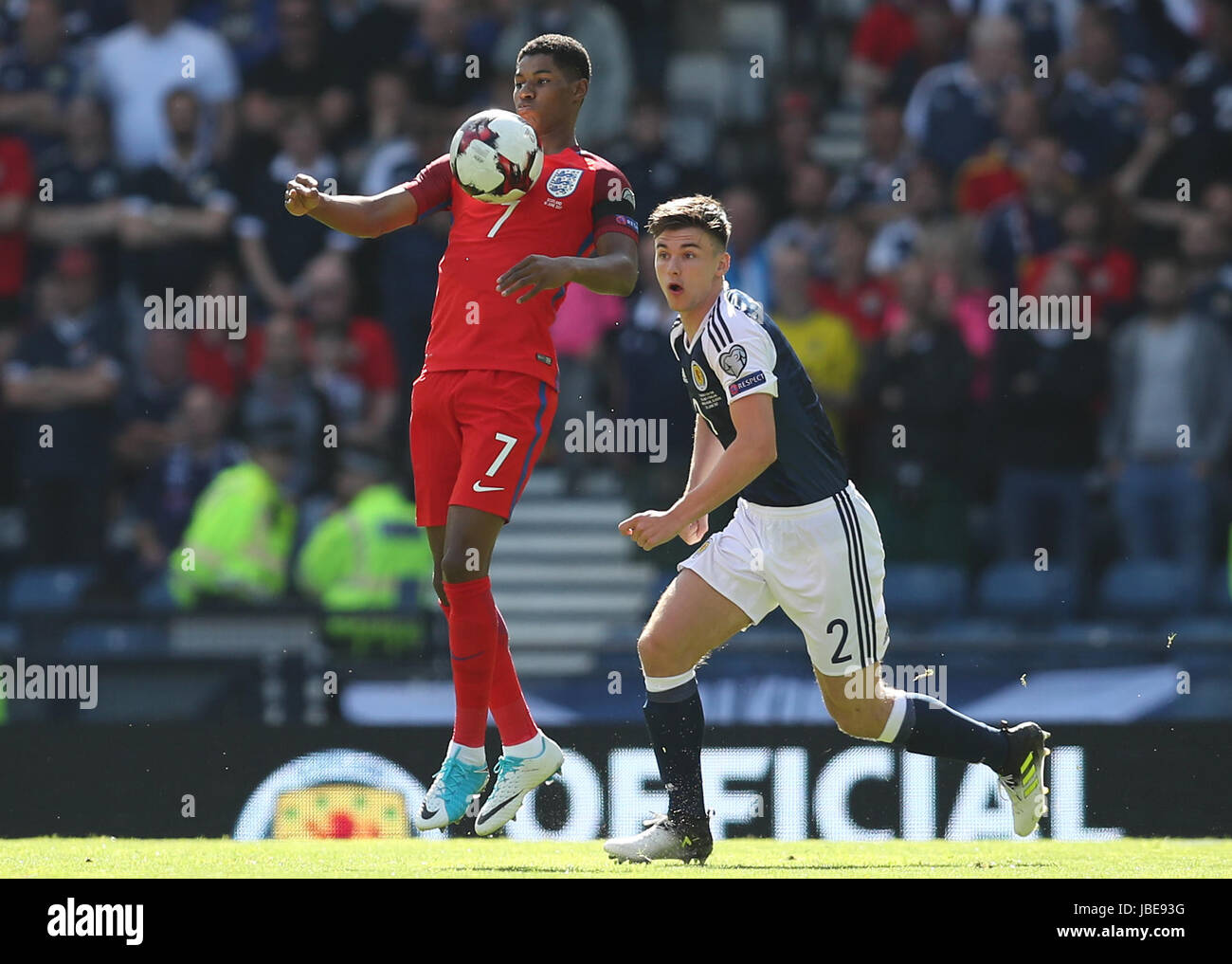 England's Marcus Rashford (left) and Scotland's Kieran Tierney battle for the ball during the 2018 FIFA World Cup qualifying, Group F match at Hampden Park, Glasgow. Stock Photo