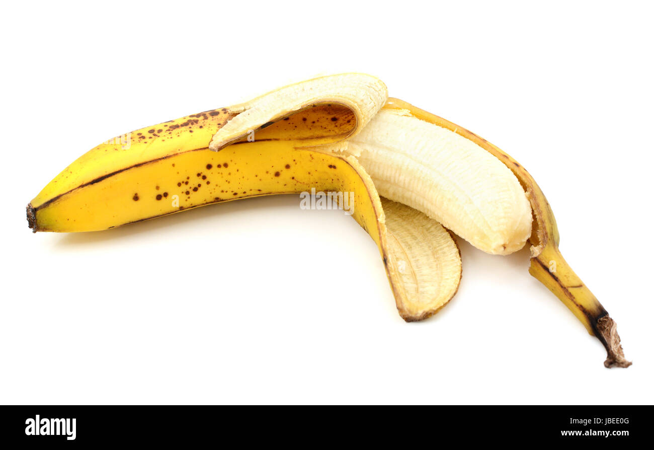 Halfpeeled overripe, spotty banana, isolated on a white background