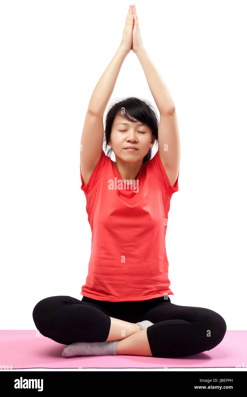 Woman practicing yoga isolated on white background Stock Photo - Alamy