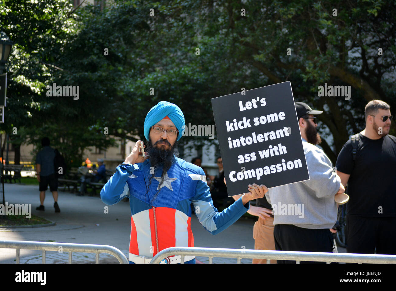 People holding signs supporting Islam at a counter protest to an anti-Sharia rally in New York City. Stock Photo