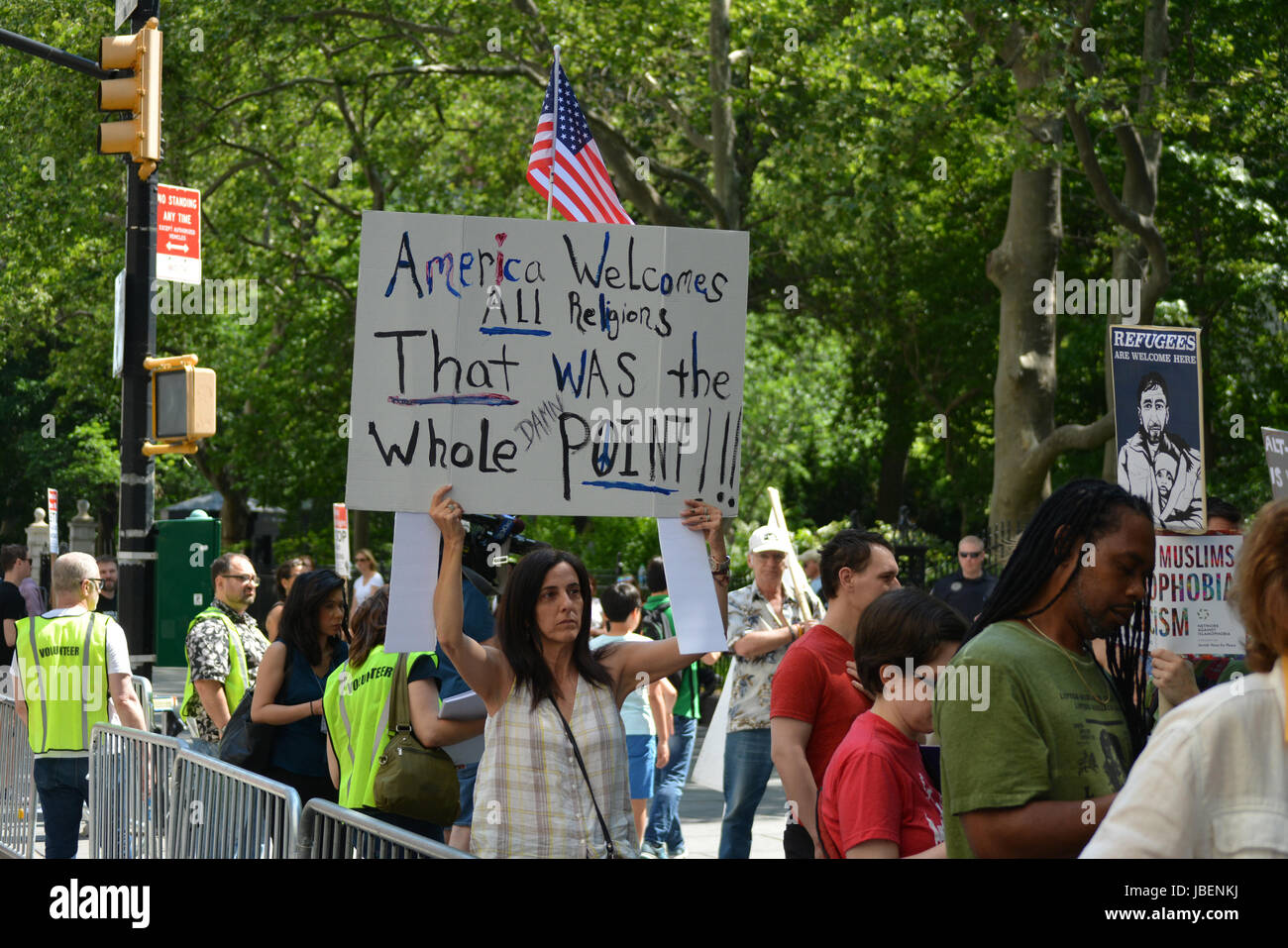 People holding signs supporting Islam at a counter protest to an anti-Sharia rally in New York City. Stock Photo