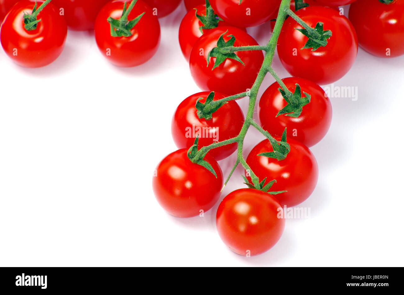 cherry tomatoes isolated on white Stock Photo - Alamy