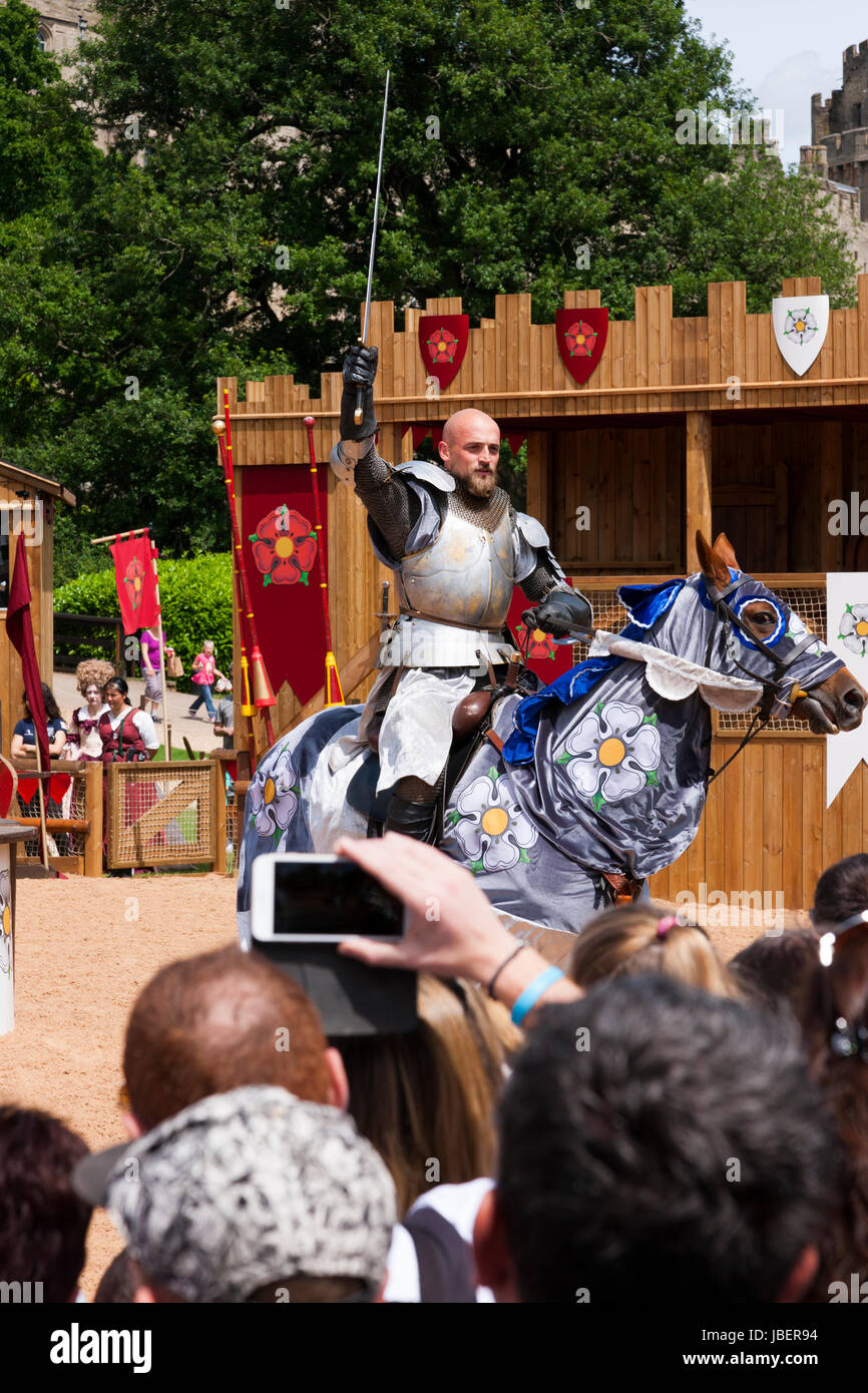 War of the Roses jousting battle re-enactment performed in front of an audience of tourists at Warwick castle in Warwickshire. UK. (88) Stock Photo