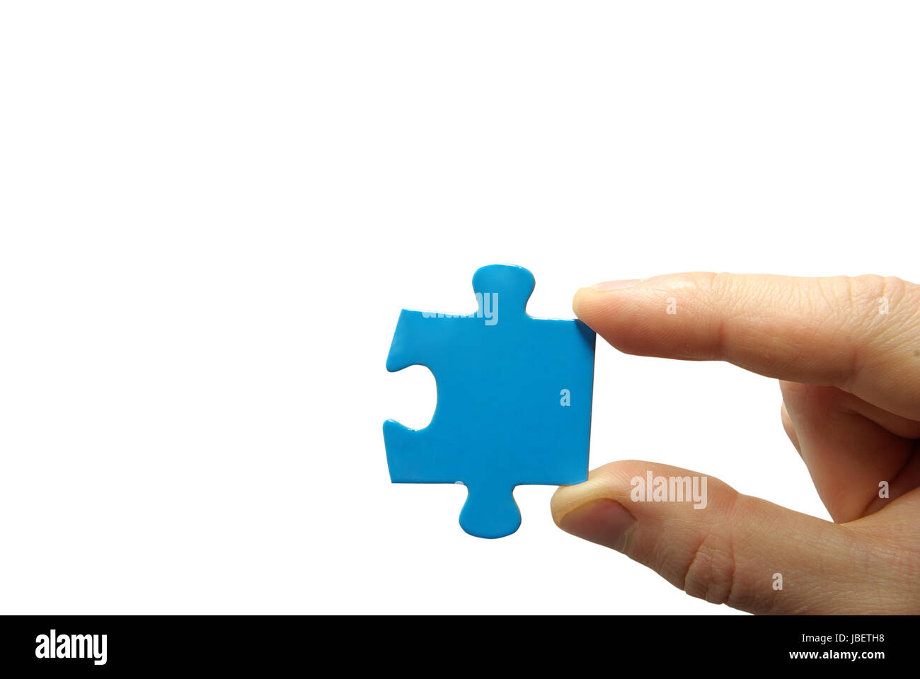 puzzle in hand isolated on white background Stock Photo - Alamy