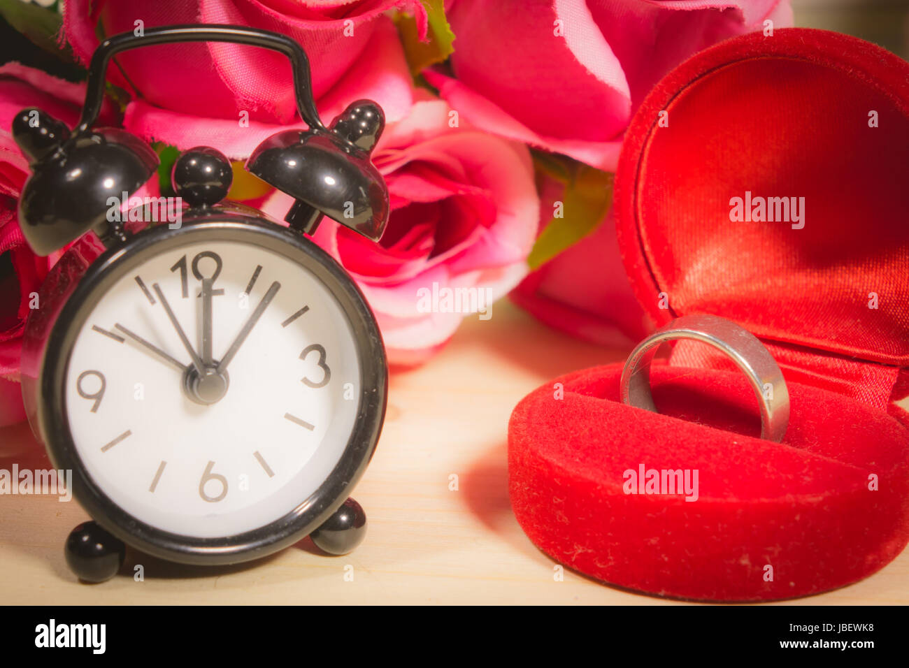 Wedding ring, alarm clock Tell time in life Stock Photo