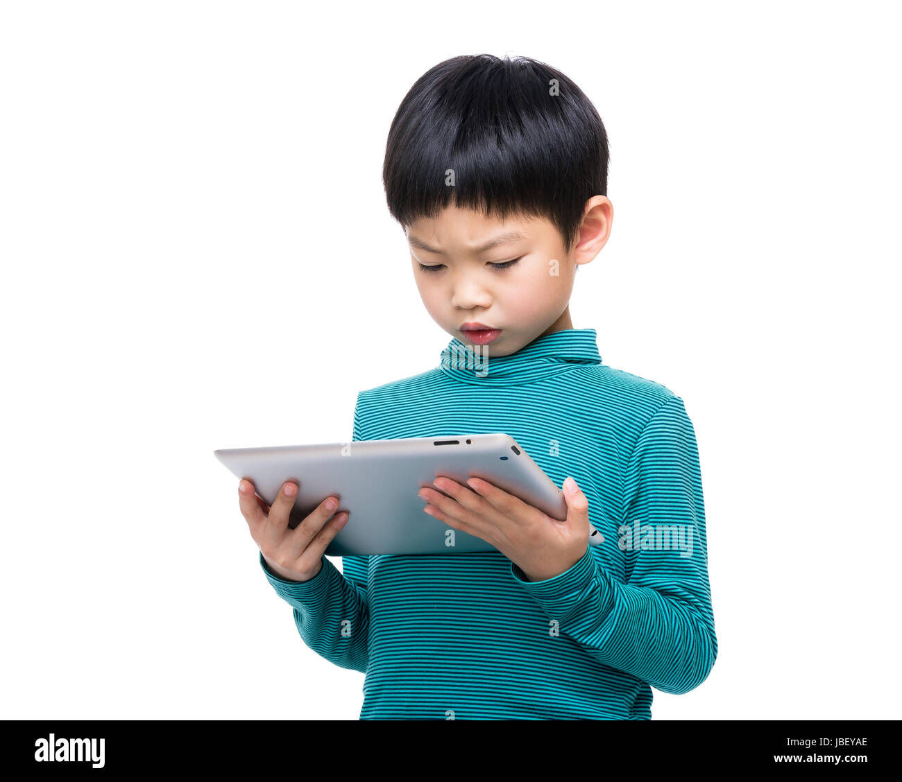 Asia little boy using tablet isolated on white Stock Photo - Alamy