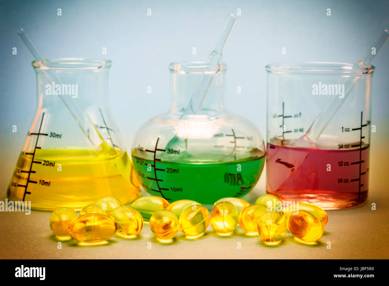 Oil capsules and flask chemical Stock Photo
