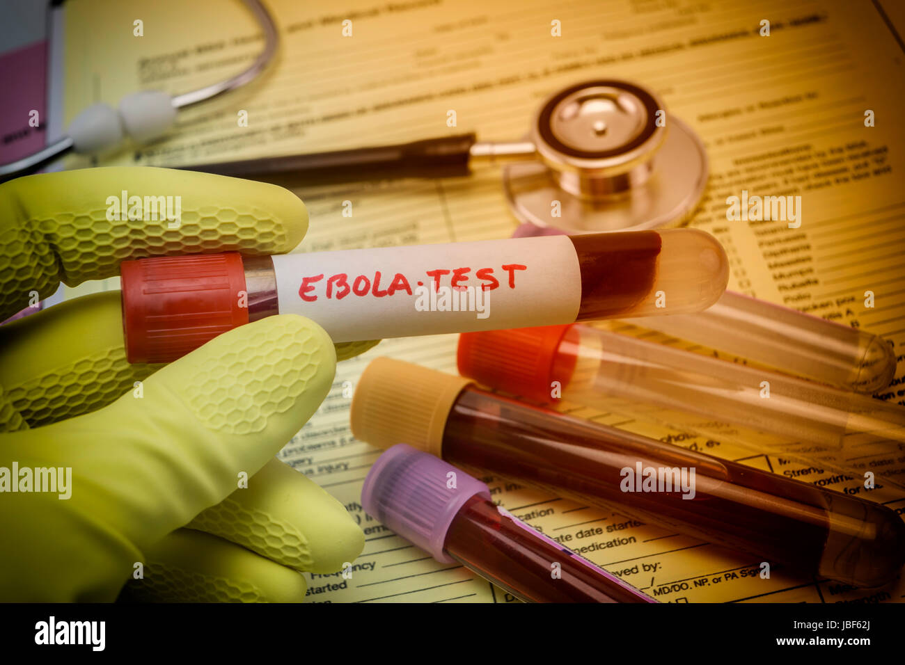 Tests For Research Of Ebola virus, Doctor holding a vial of vaccine virus Ebola Stock Photo