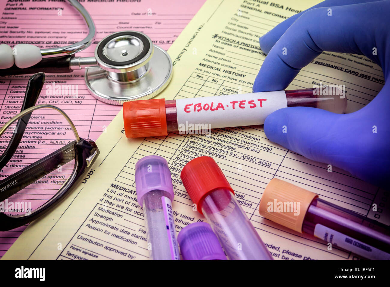 Tests For Research Of Ebola virus Doctor holding a vial of vaccine virus Ebola Stock Photo