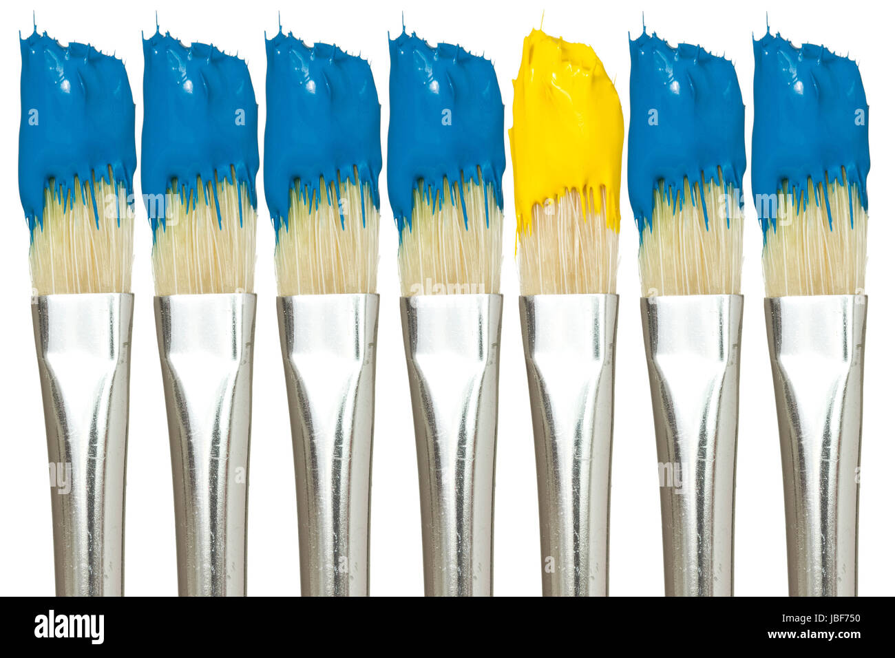 Paint brushes with blue and yellow paints, isolated on white background