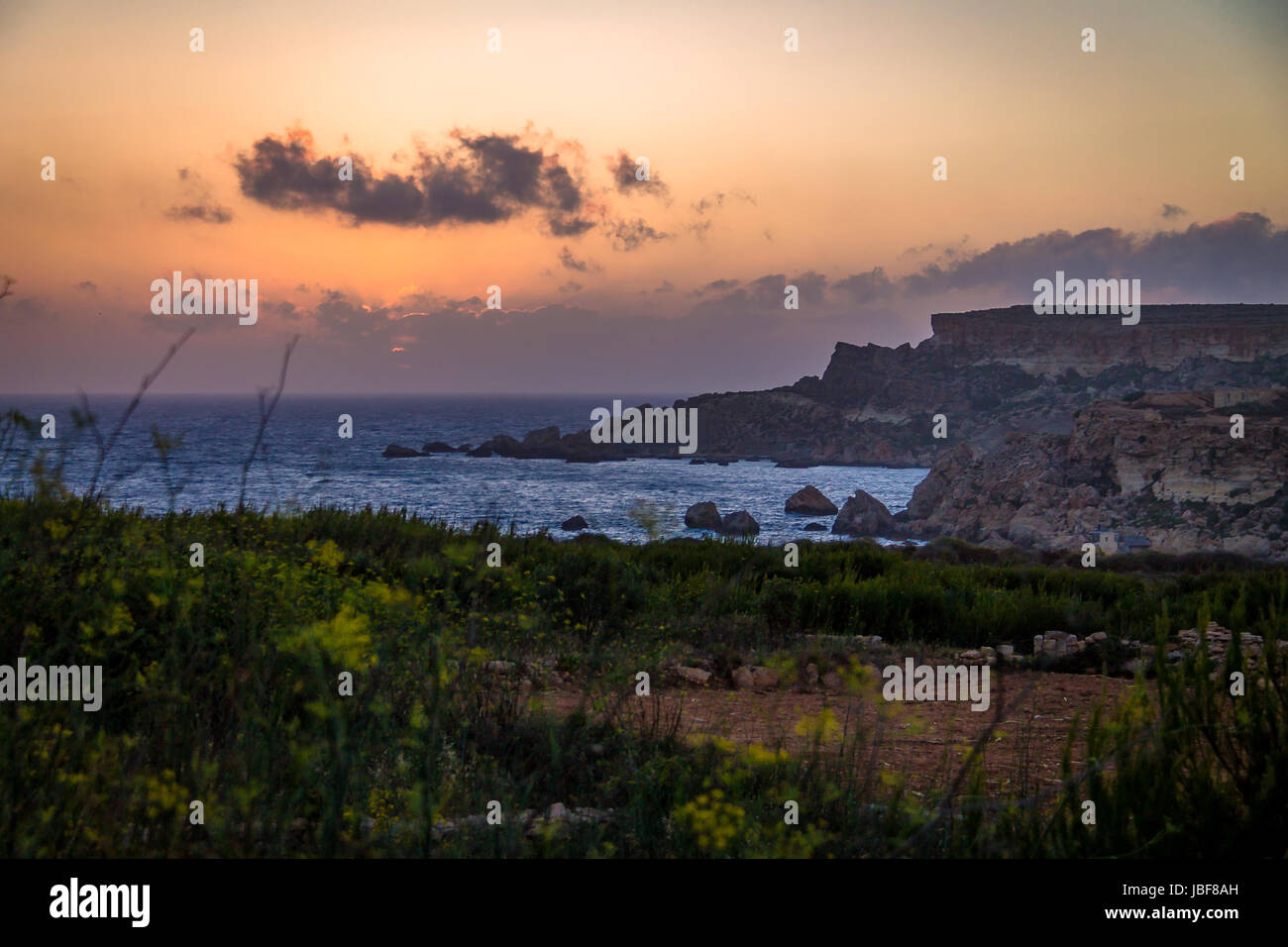 Golden Bay in Ghajn Tuffieha Tower sunset - Malta Stock Photo - Alamy