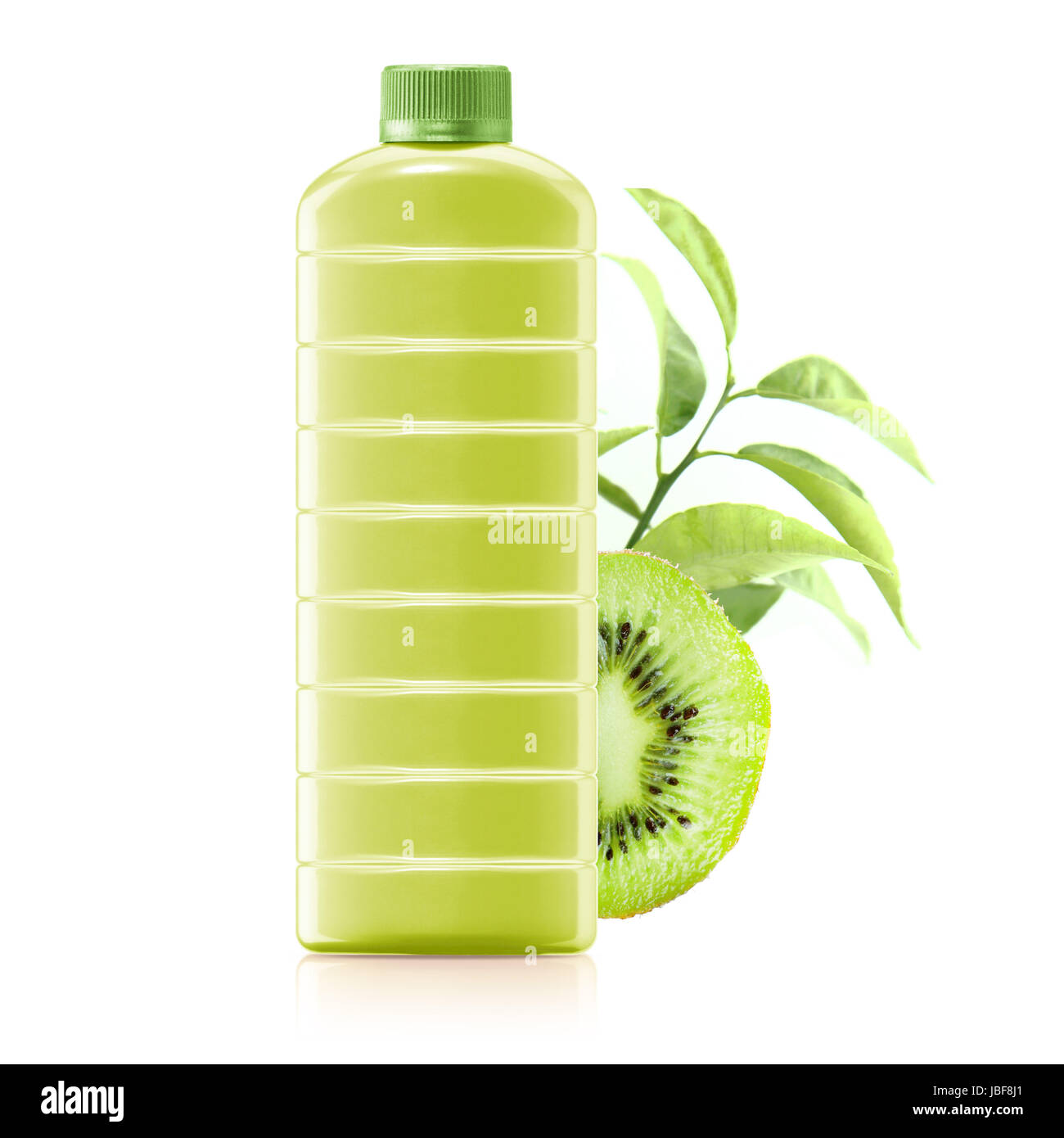 kiwi juice in a plastic container jug with fresh kiwi and leaves on a white background. Stock Photo