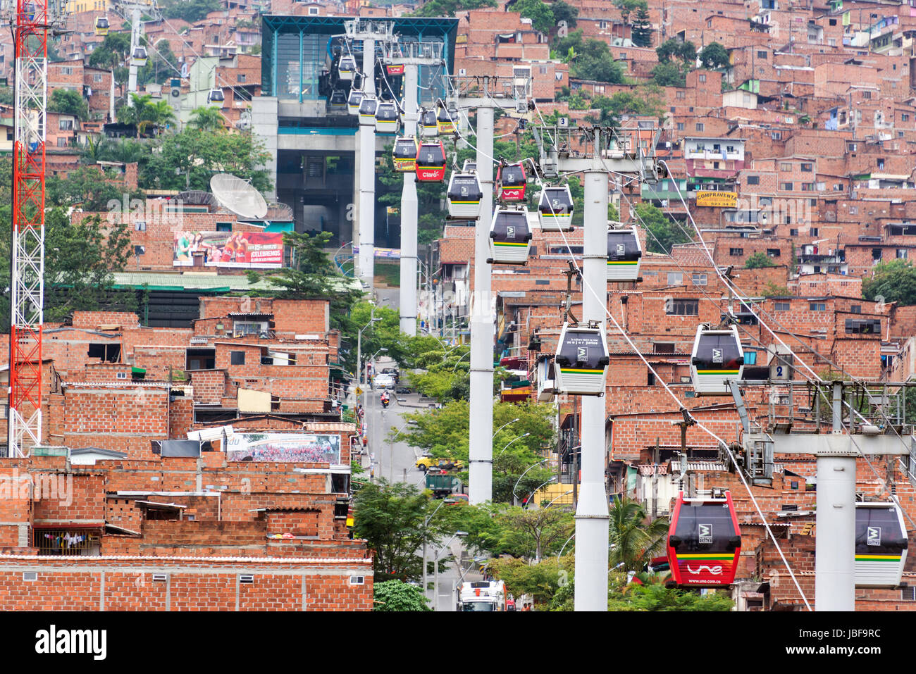 MEDELLIN, COLOMBIA - MARCH 8: Metrocable cars arriving at a station in Medellin, Colombia on March 8, 2014.  Metrocable is the first gondola lift system in the world dedicated to public transportation. Stock Photo