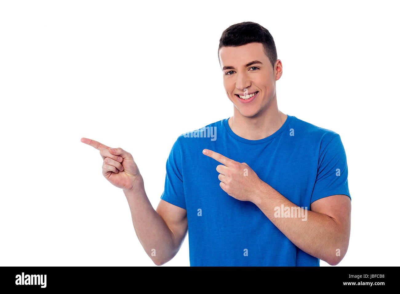 Look Point Guy Handsome young guy looking and pointing away Stock Photo - Alamy