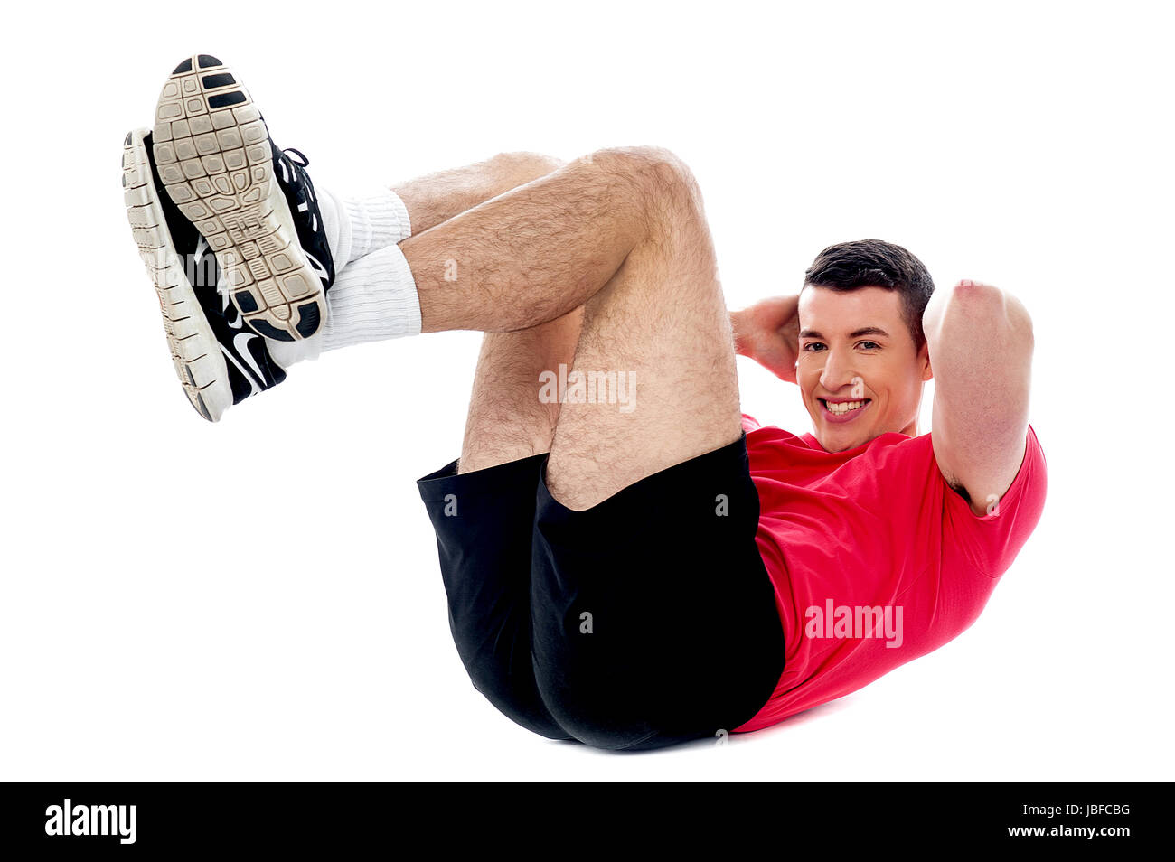 Young fit guy doing abs exercise Stock Photo - Alamy