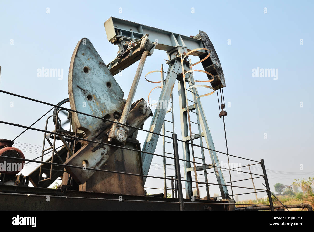 old pumpjack pumping crude oil from oil well Stock Photo Alamy