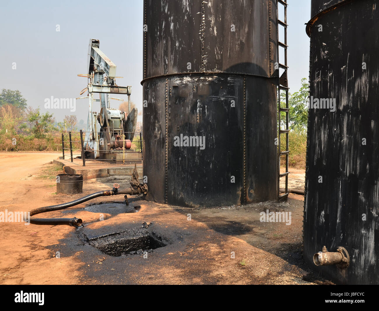 old pumpjack pumping crude oil from oil well Stock Photo Alamy