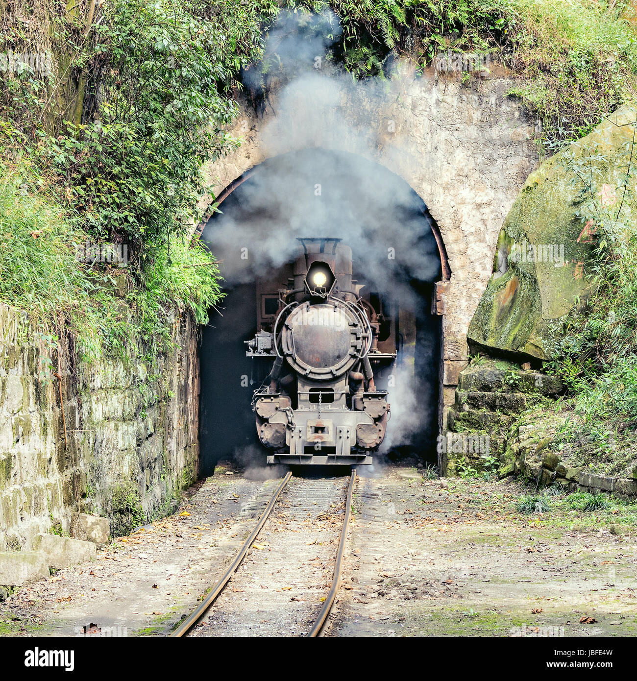 Steam narrow-gauge train moves from Yuejin to Bagou through the tunnel ...