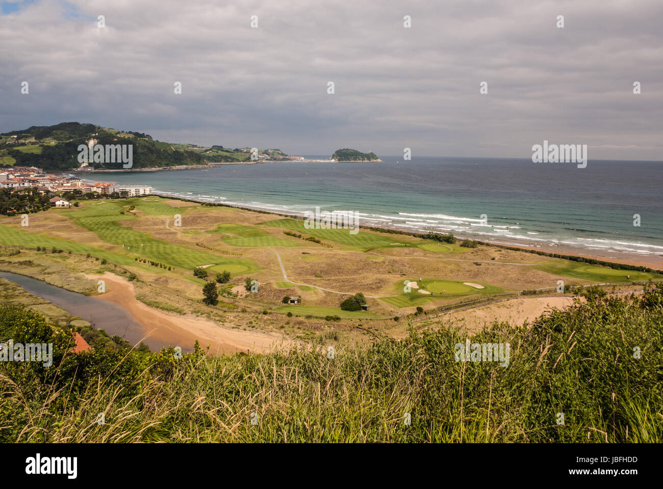 Panoramic view of Zarautz with Guetaria on the background on a bright sunny summer day. Stock Photo