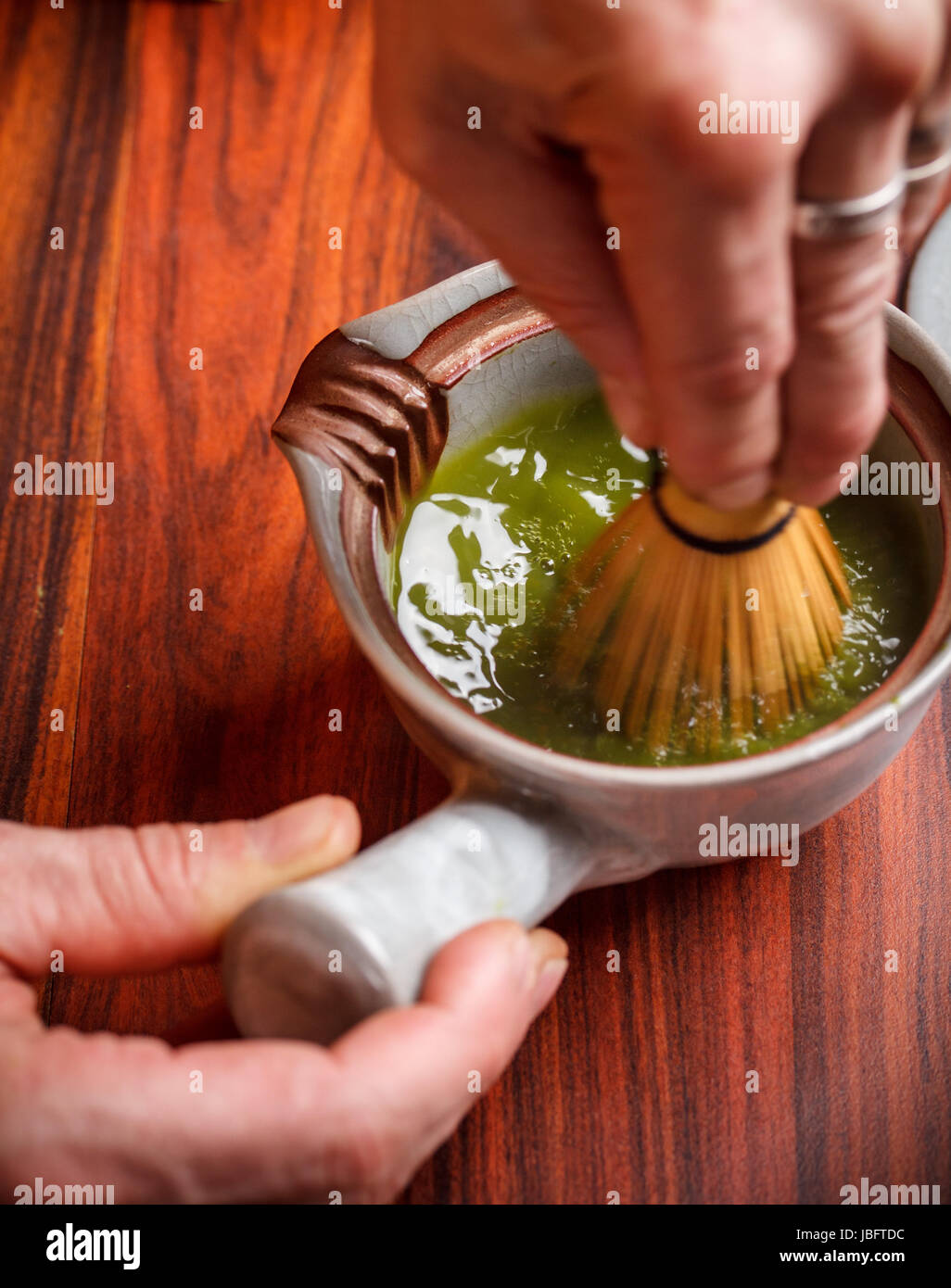 Tea master make matcha tea with tea whisk Stock Photo