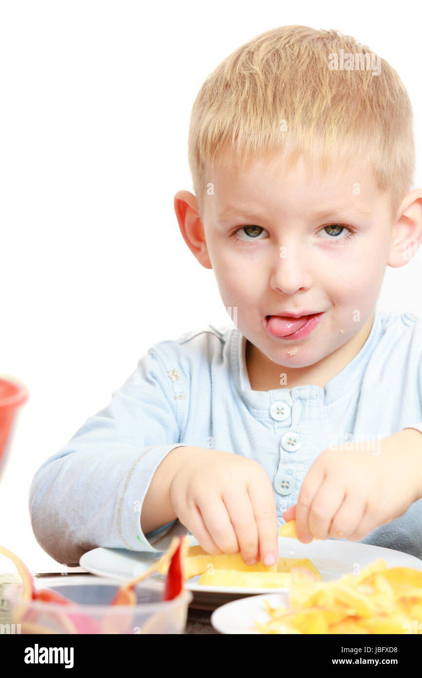 Happy childhood. Boy child kid preschooler eating peeled apple fruit or