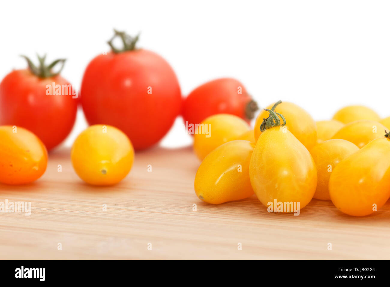 harvested tomatoes on wood. Stock Photo