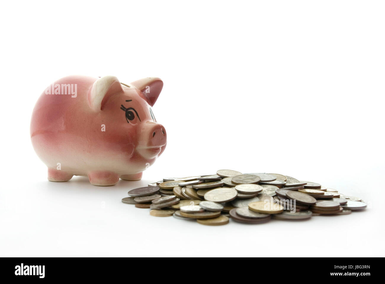 Pink piggy bank isolated on white background with coins Stock Photo - Alamy